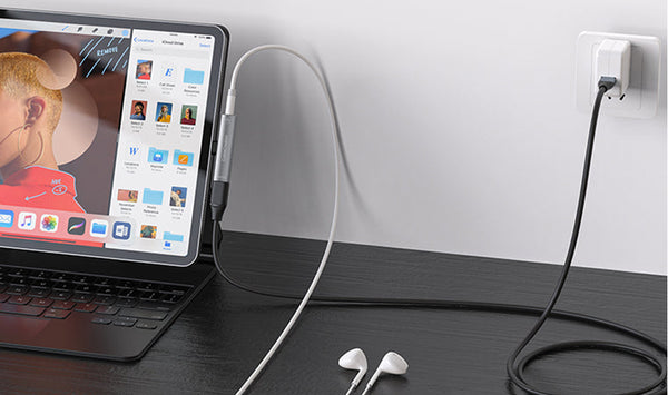 A Charger and Headphone Adapter Realizes Listening to Music and Charge Phones and Ipad Simultaneously